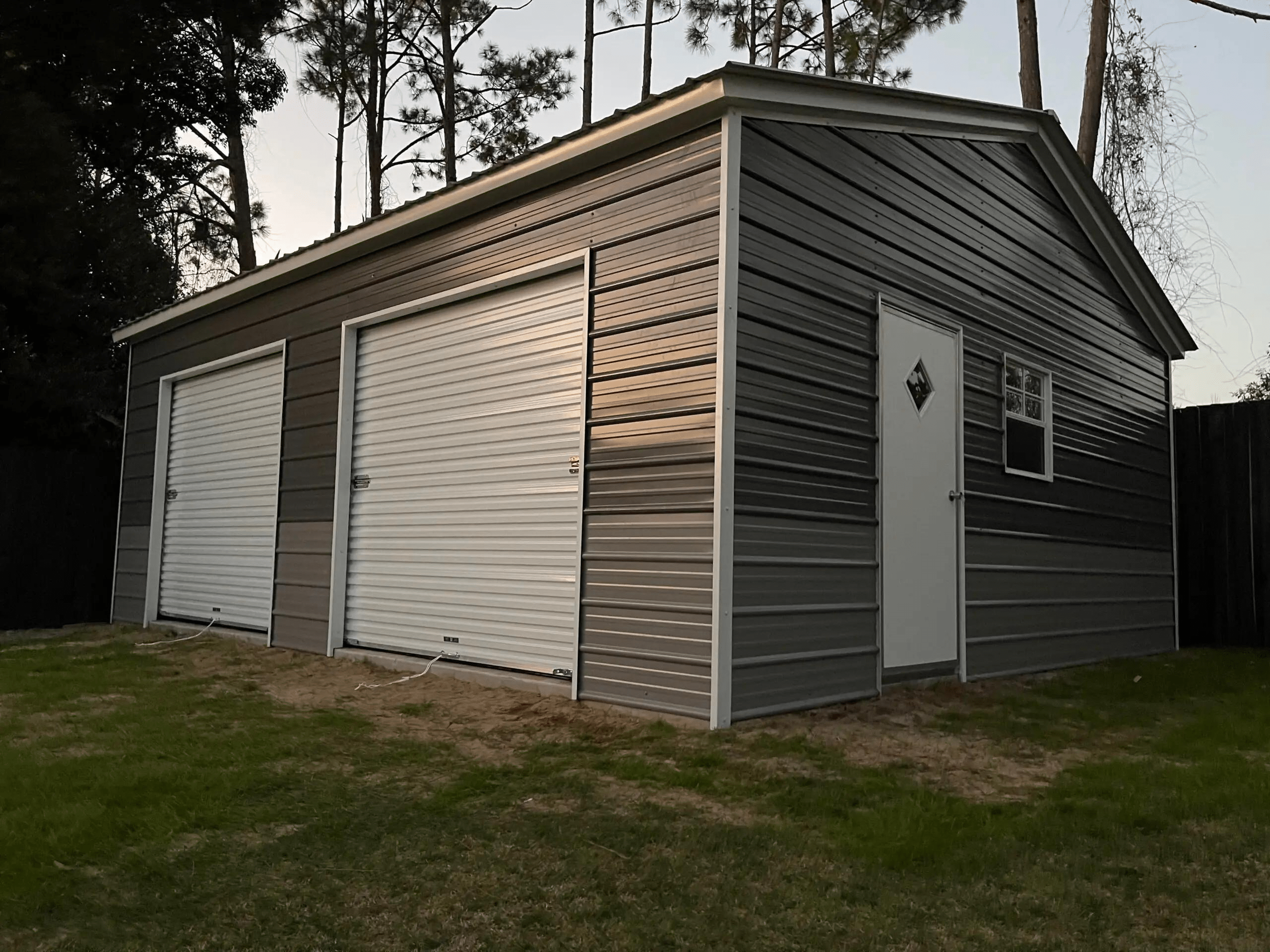 Elegant metal garage with three doors