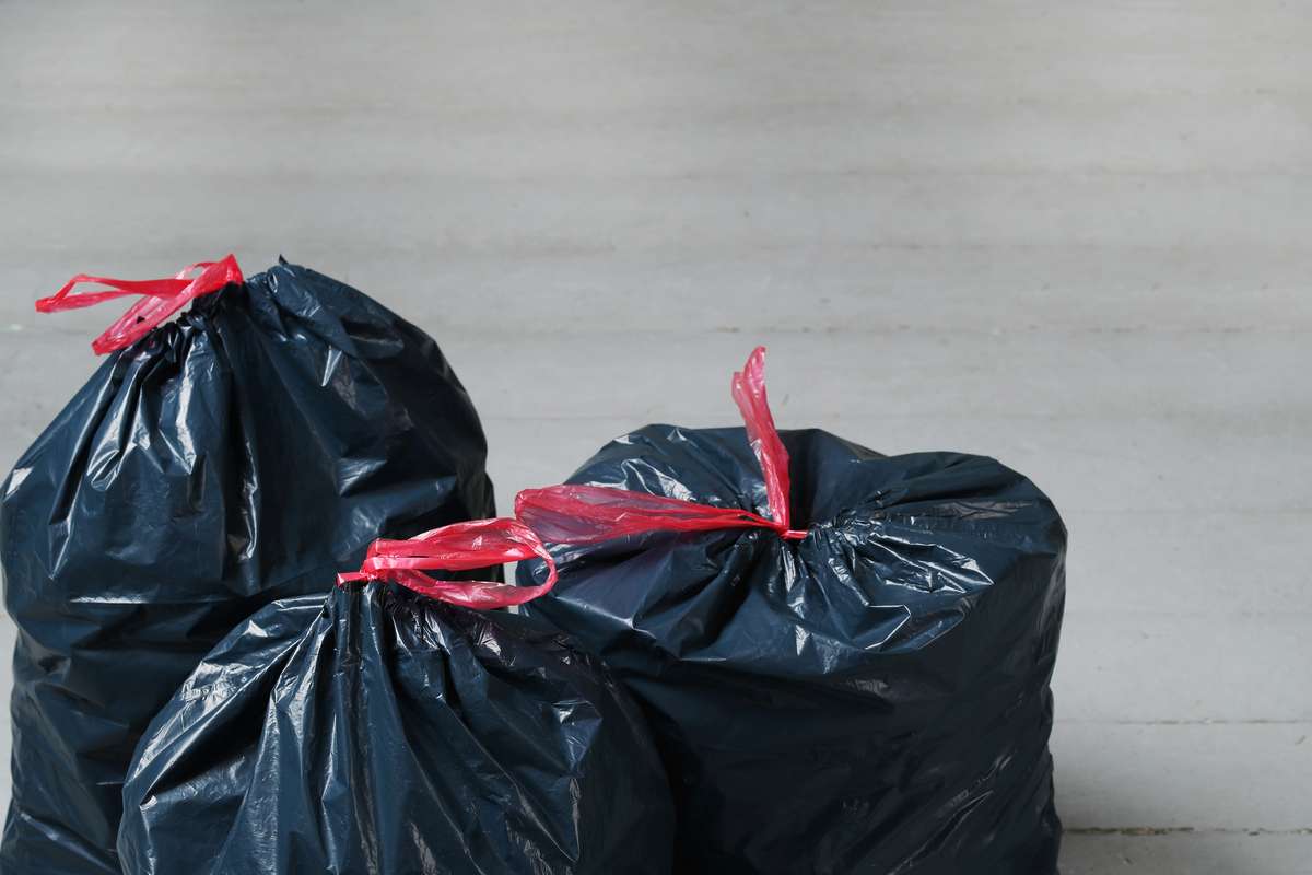 Three bags of waste ready for disposal.