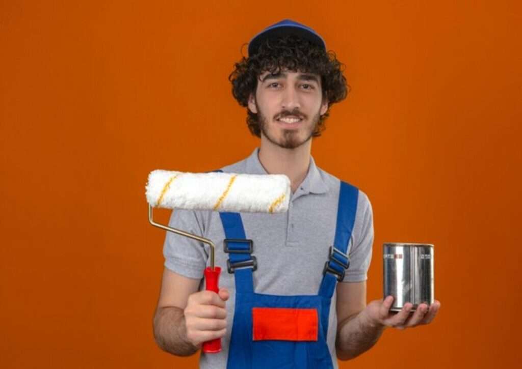 A young man doing DIY painting project