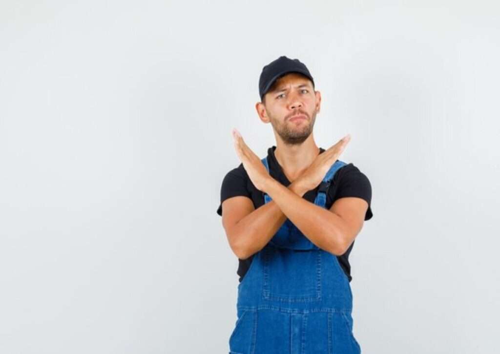 A young man making a stop gesture