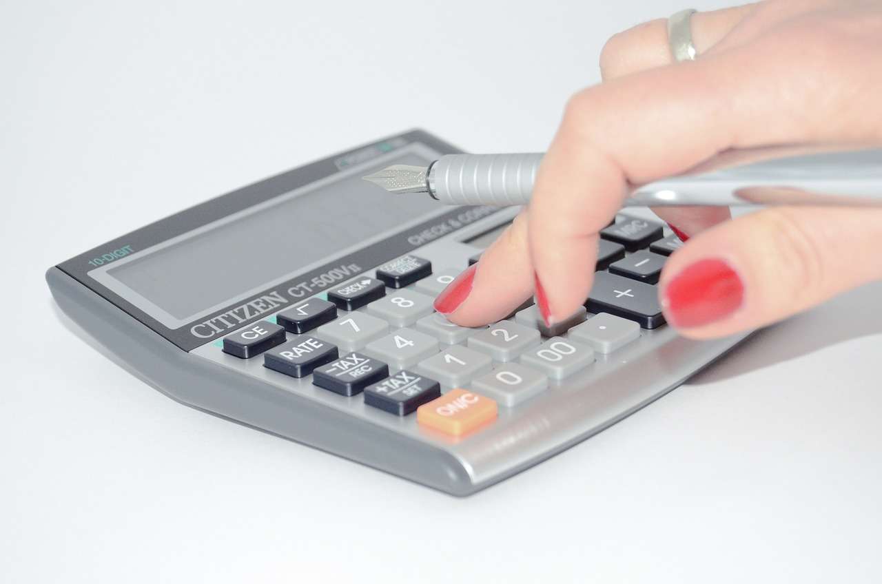 A person using a calculator