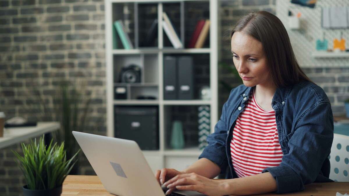 A woman applying for a building permit for a steel building construction project.