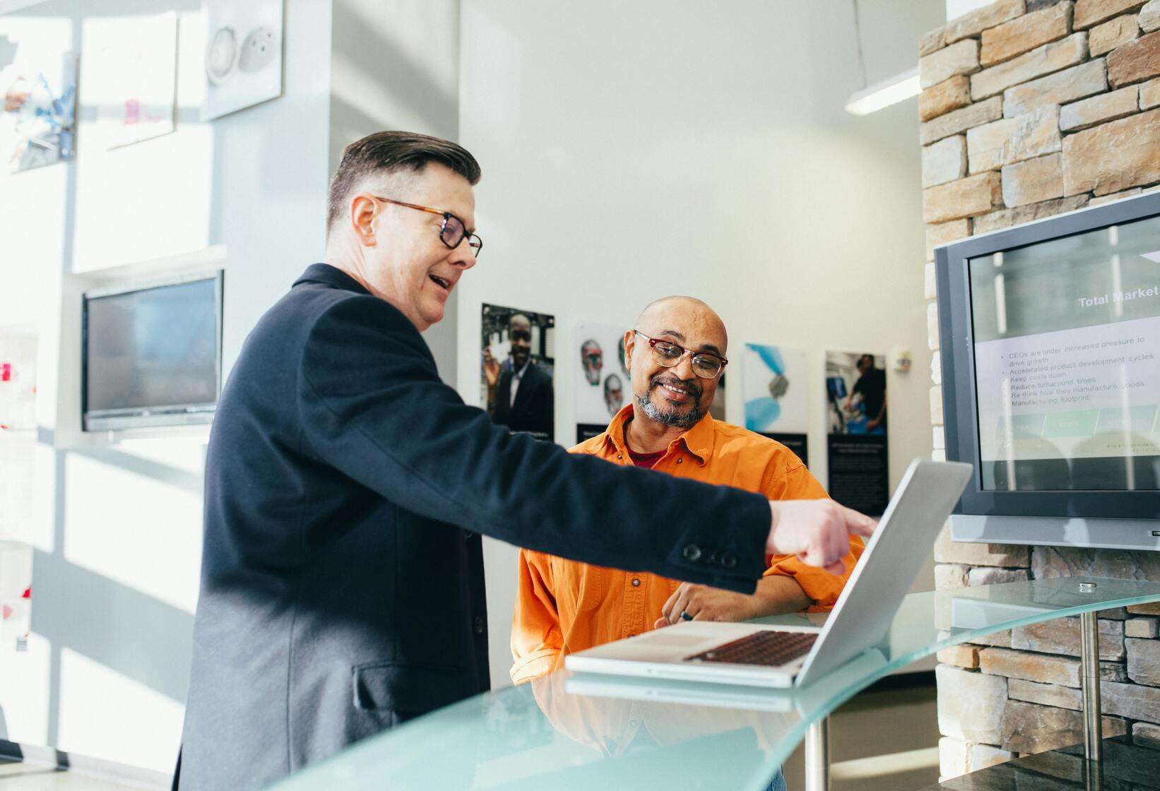 Two people selecting site location for metal building