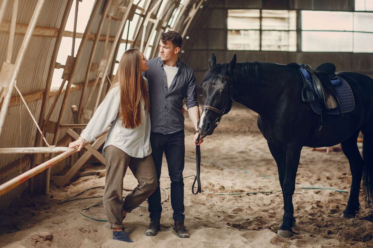 A couple enjoying their time with their horse