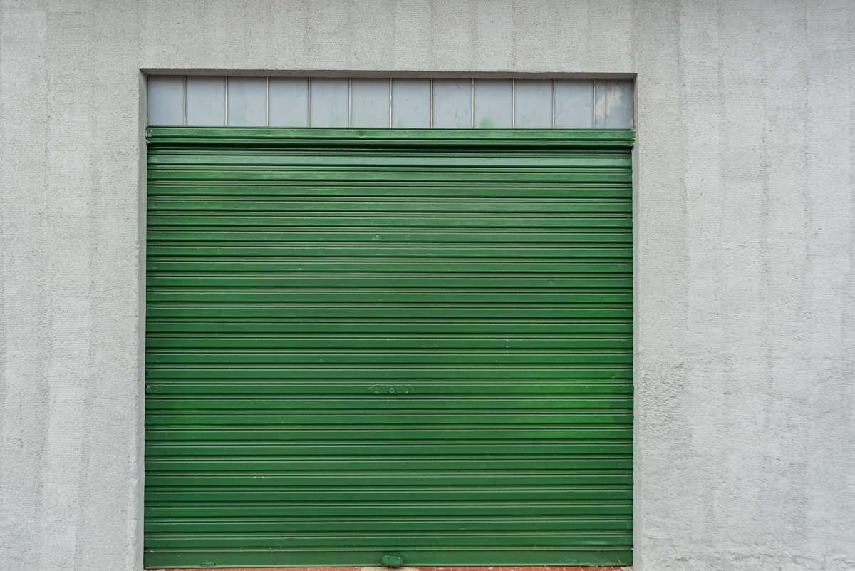 A green commercial building door.