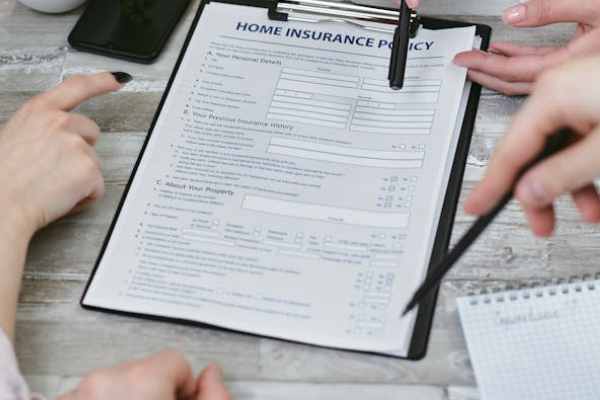 home insurance policy form being reviewed for barndominium coverage