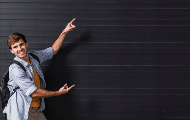 Man pointing at garage door, representing what to know about metal garage pricing.