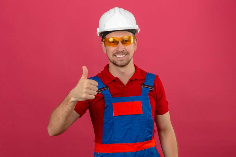 Construction worker showing why metal is best choice for prefabricated buildings.